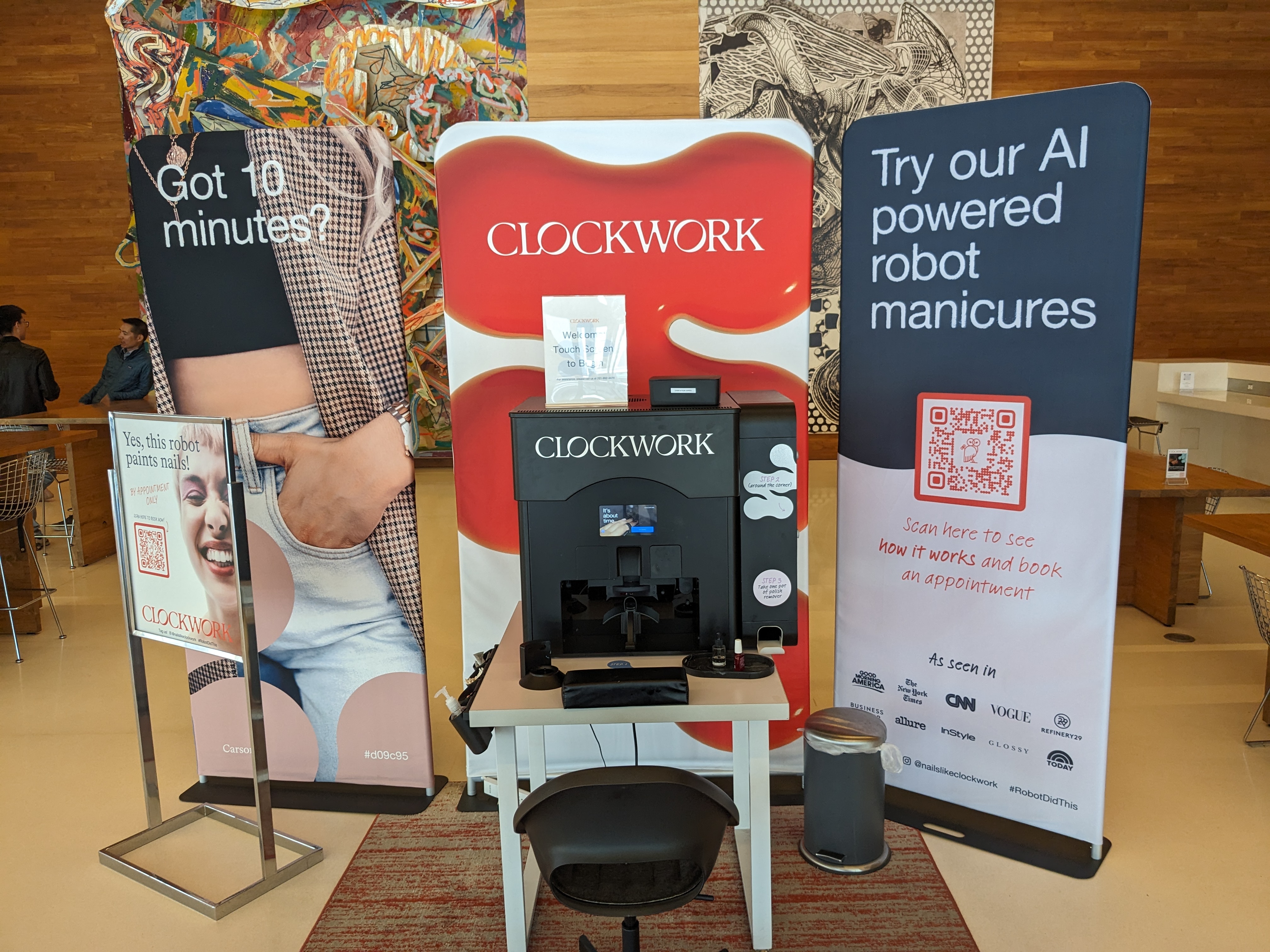 Clockwork demo booth with press logos